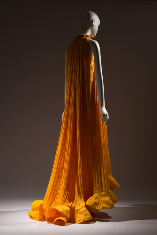 orange silk gown, viewed from behind