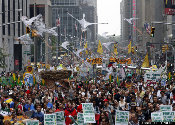 Demonstrators make their way down Sixth Avenue in New York during the People's Climate March Sunday, Sept. 21, 2014.  The march, along with similar gatherings scheduled in other cities worldwide, comes two days before the United Nations Climate Summit, where more than 120 world leaders will convene for a meeting aimed at galvanizing political will for a new global climate treaty by the end of 2015. (AP Photo/Jason DeCrow)