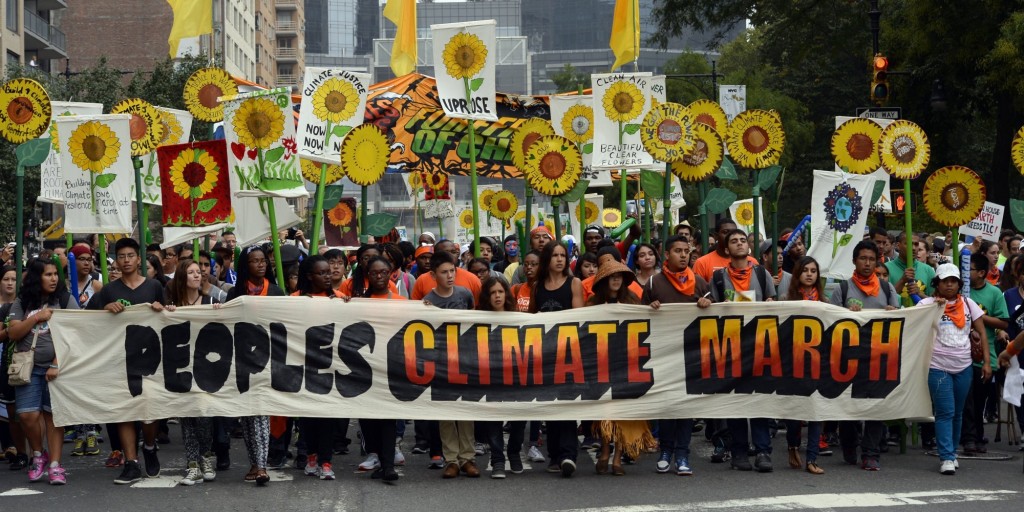 Marchers make their way across Central Park South during the People's Climate March on September 21 2014, in New York. Activists mobilized in cities across the globe Sunday for marches against climate change, with one of the biggest planned for New York, where celebrities, political leaders and tens of thousands of people were expected. The march comes before the United Nations Secretary-General Ban Ki-moon convenes a climate change summit of 120 world leaders .   AFP PHOTO/Timothy A. Clary        (Photo credit should read TIMOTHY A. CLARY/AFP/Getty Images)