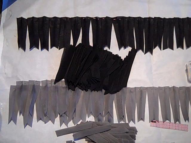 Laying out the layers of texture and pinning them to the tulle/paper