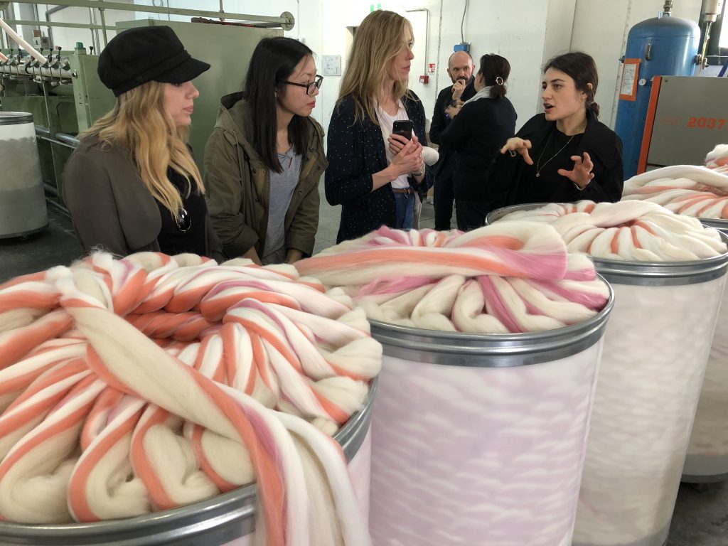 Inside a spinning mill, students see luxury yarn being created. 