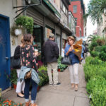 people looking at plants along 28th street