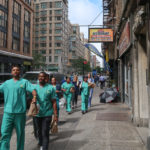 hospital workers walking down the street
