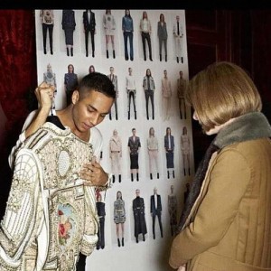Olivier Rousteing showing Anna Wintour the embellishment on a jacket for Balmain