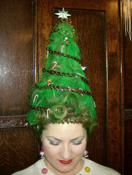 Women with green dyed hair shaped as a Christmas tree