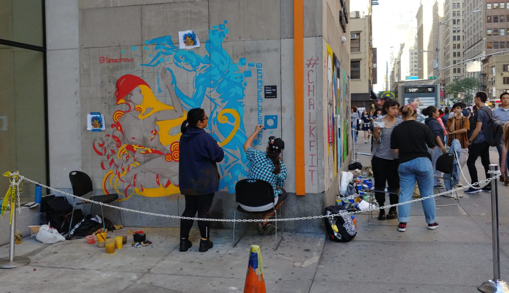 Facing up 7th Avenue while ChalkFIT students work