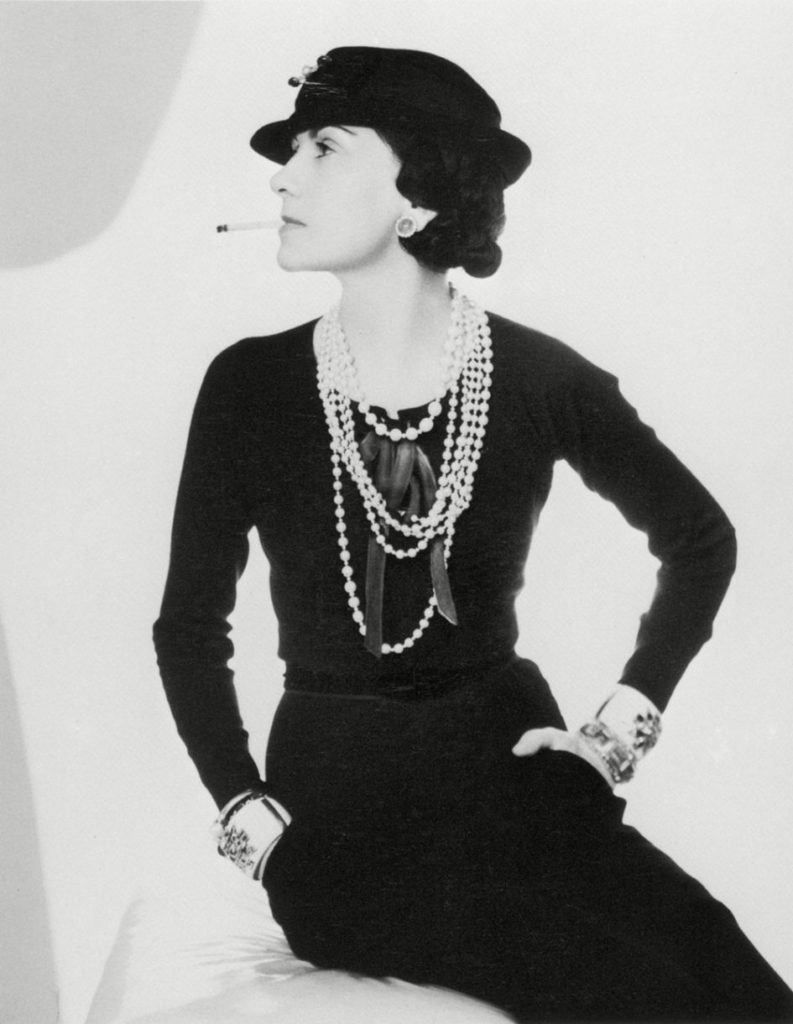 Coco Chanel in her famous all black with costume jewelry, 1935