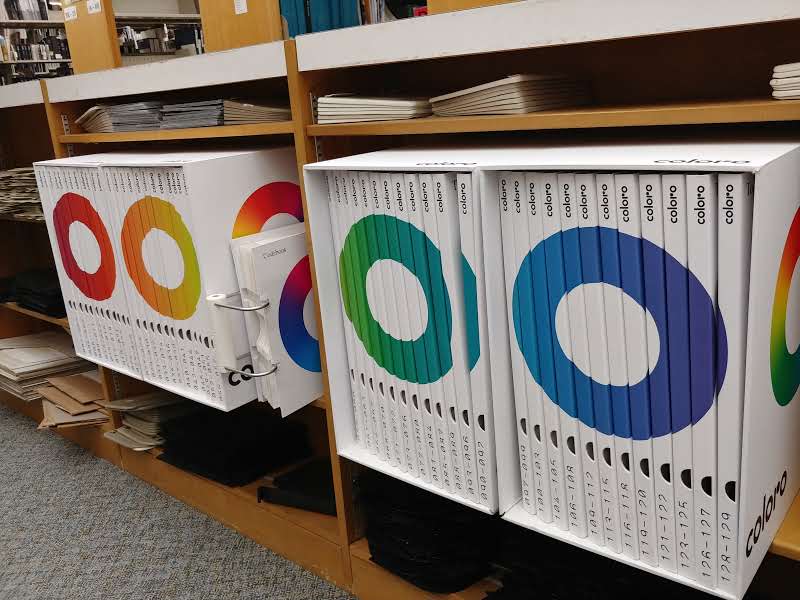 Several of the Coloro color service binders