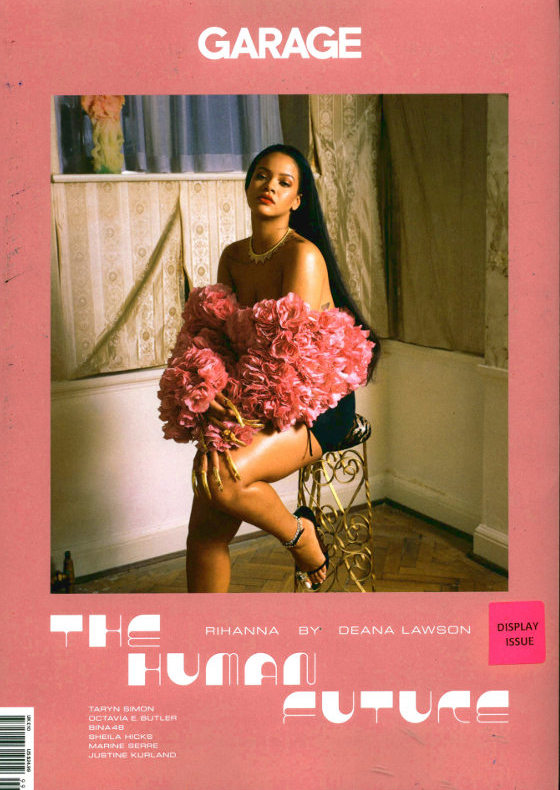 Cover of Garage magazine, photo of Rihanna sitting in floral wrap